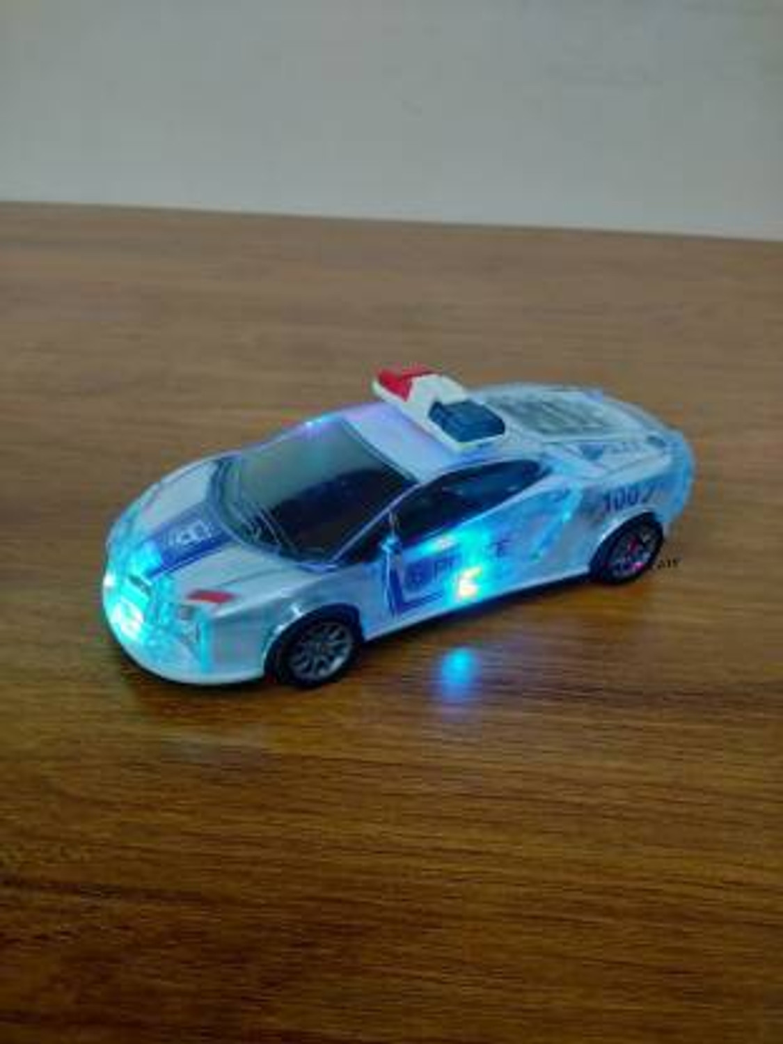 Image of ANANYA CREATIONS Police Car with Lights Friction Music and Siren Sound Police 3D Car Police Car Super Speed Colorful Dazzling Light and Music (Blue Pack of 1)