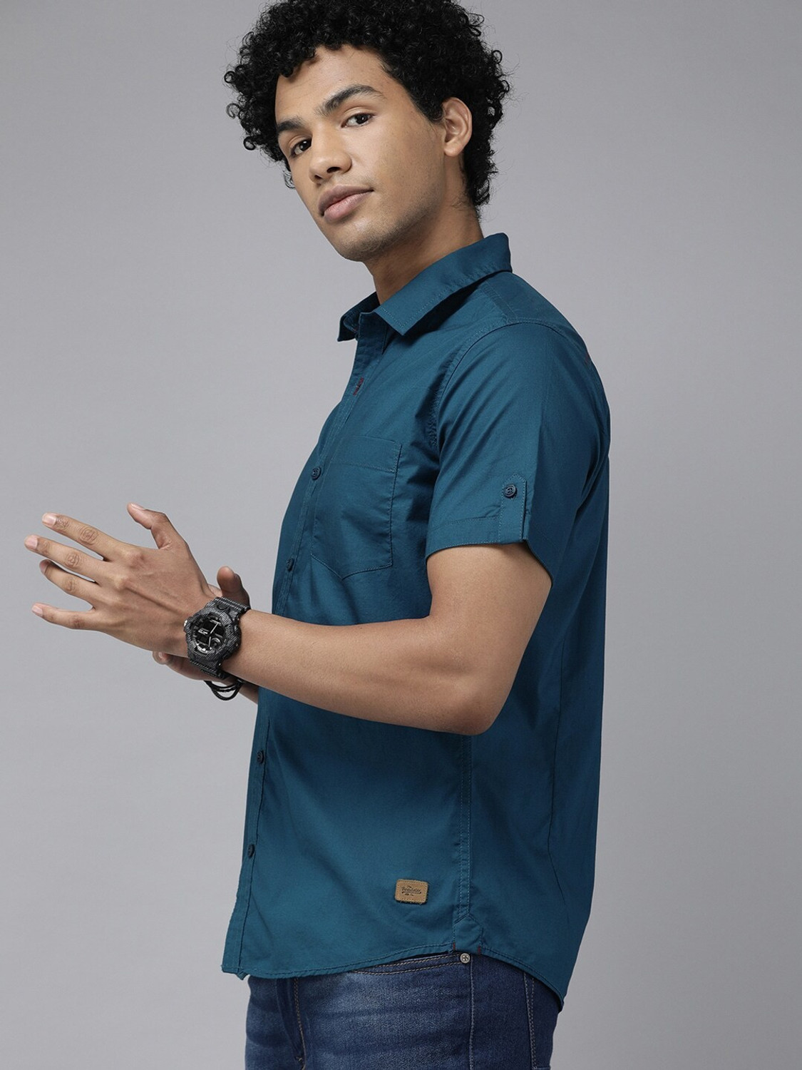 Image of Roadster Men Solid Casual Blue Shirt