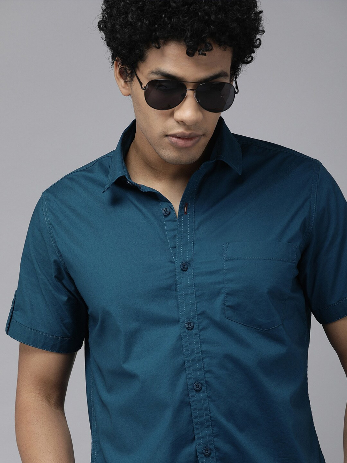Image of Roadster Men Solid Casual Blue Shirt