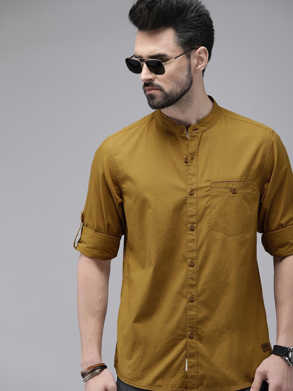 Image of Roadster Men Solid Casual Yellow Shirt