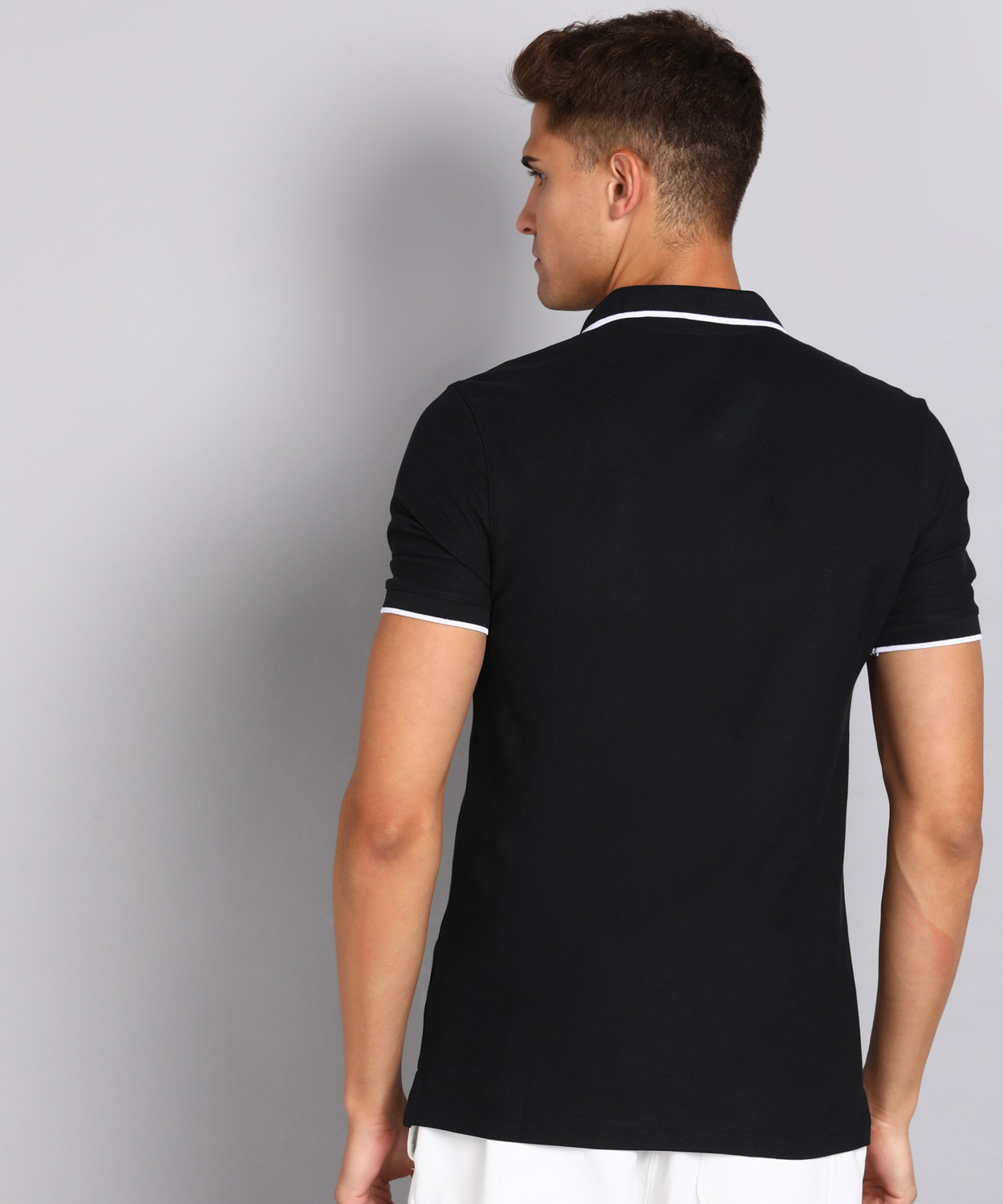 Image of REEBOK Solid Men Polo Neck Black T-Shirt