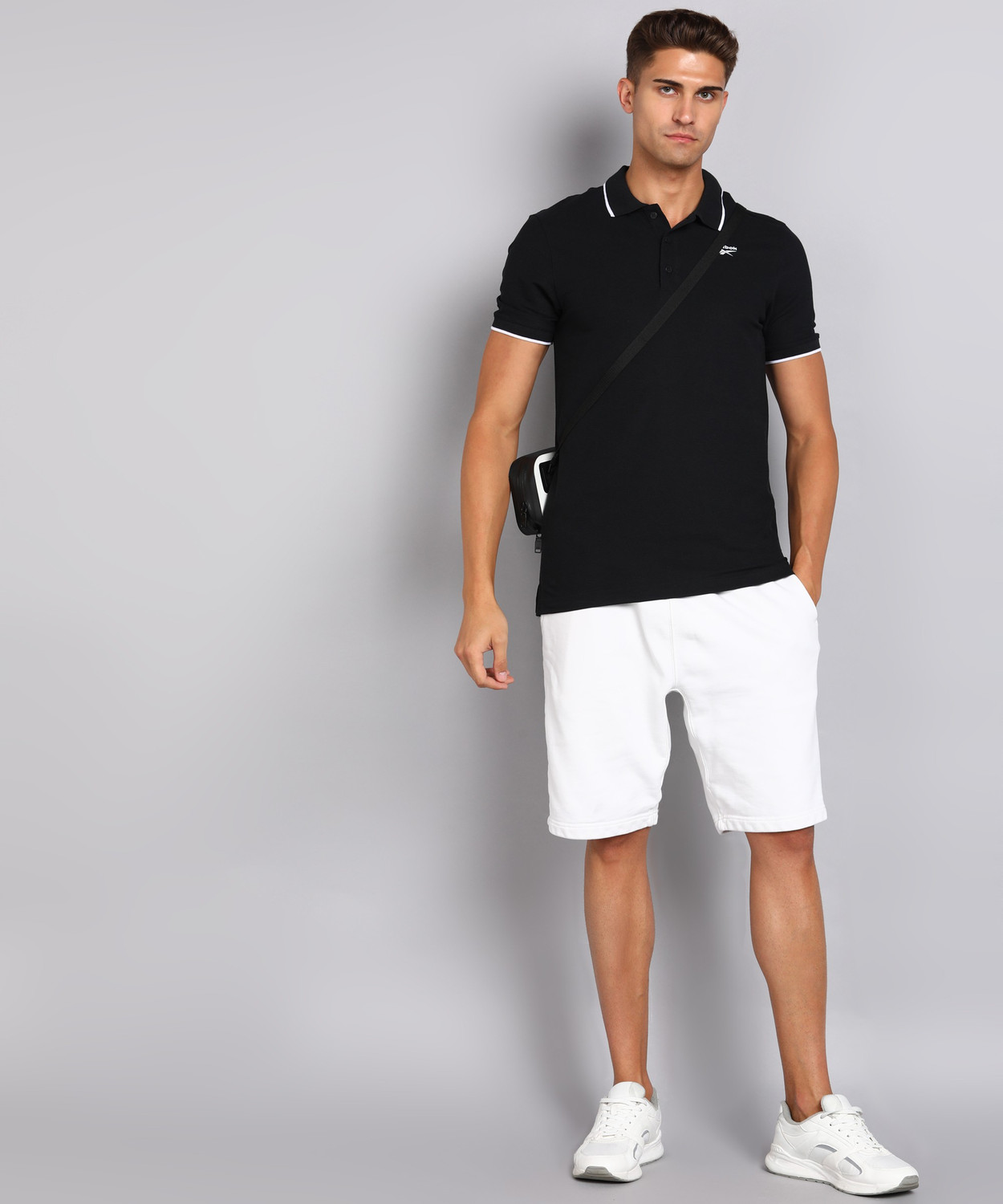 Image of REEBOK Solid Men Polo Neck Black T-Shirt