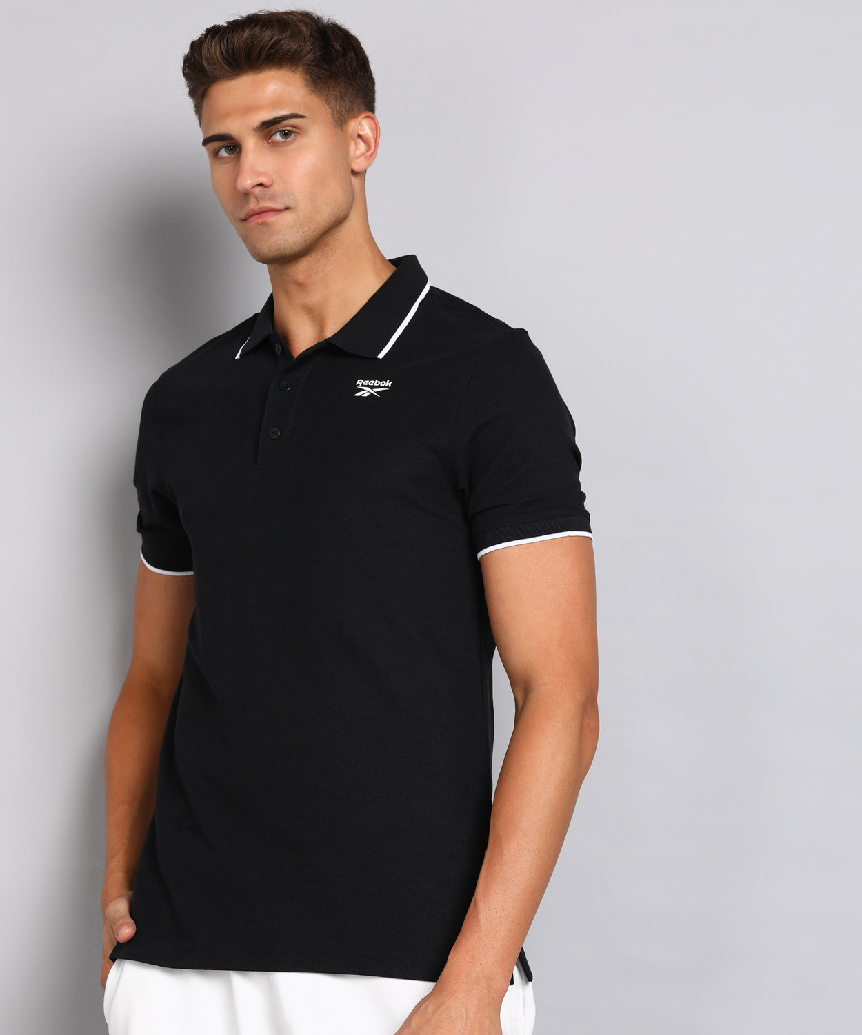Image of REEBOK Solid Men Polo Neck Black T-Shirt