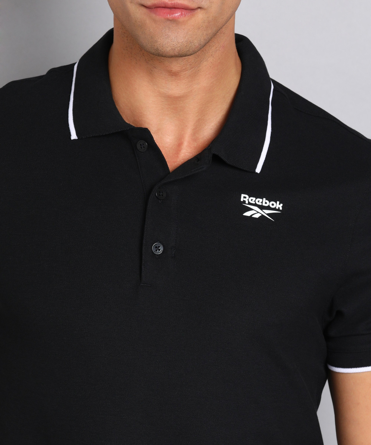 Image of REEBOK Solid Men Polo Neck Black T-Shirt