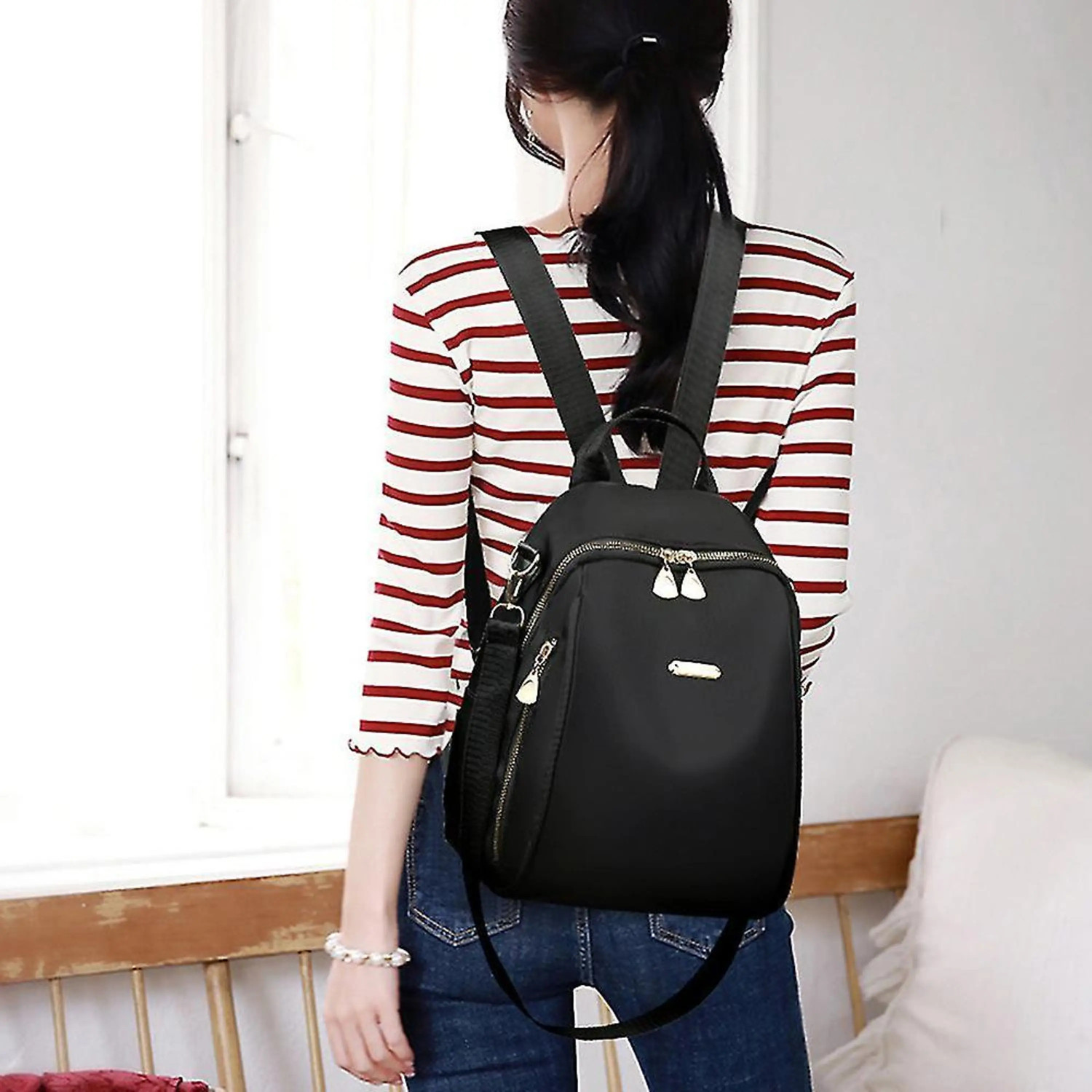 Image of speginic Trendy women's backpack handbag with a sleek solid black look and golden zippers 15 L Backpack