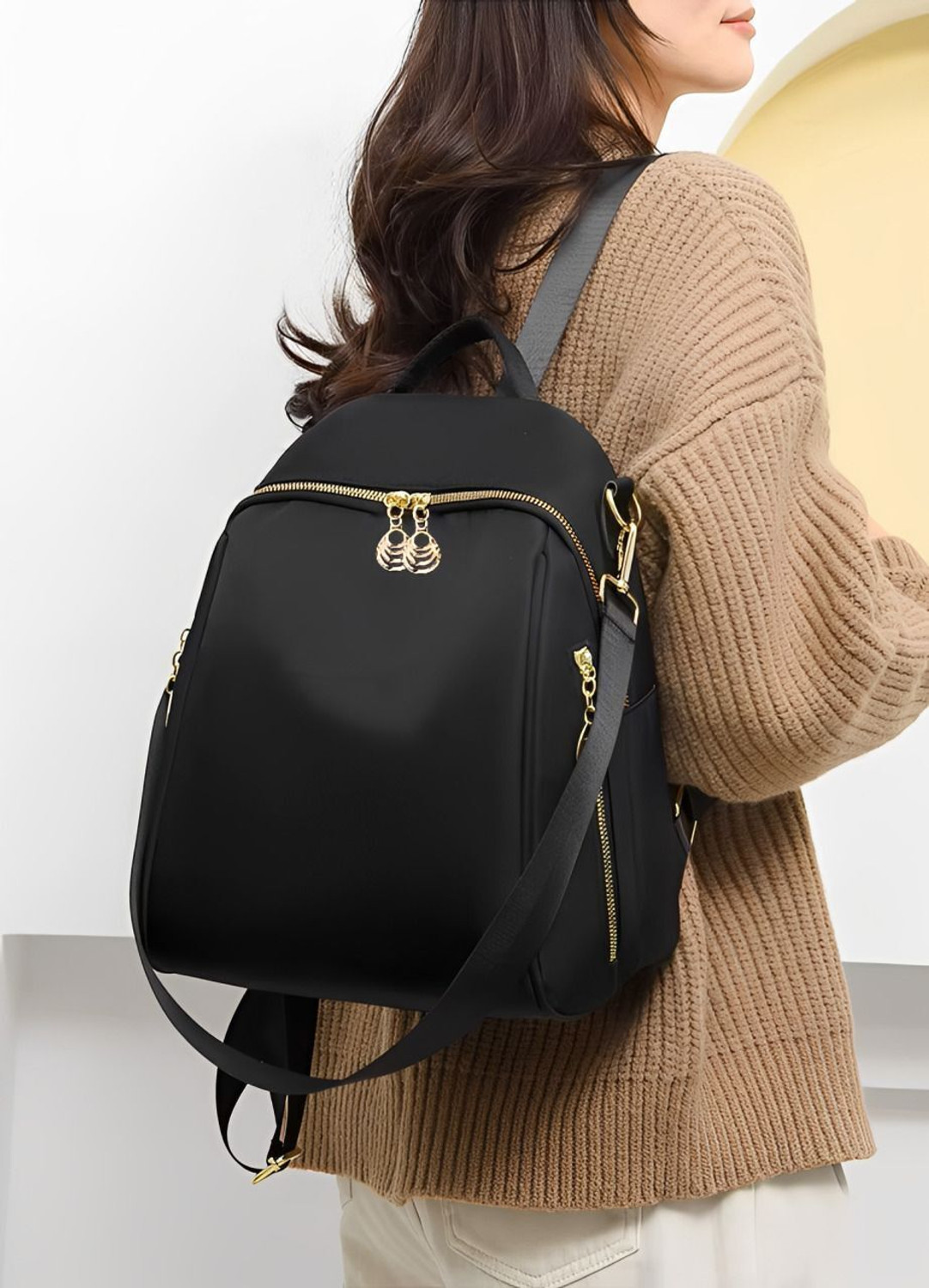 Image of speginic Trendy women's backpack handbag with a sleek solid black look and Jhumka zippers 25 L Backpack