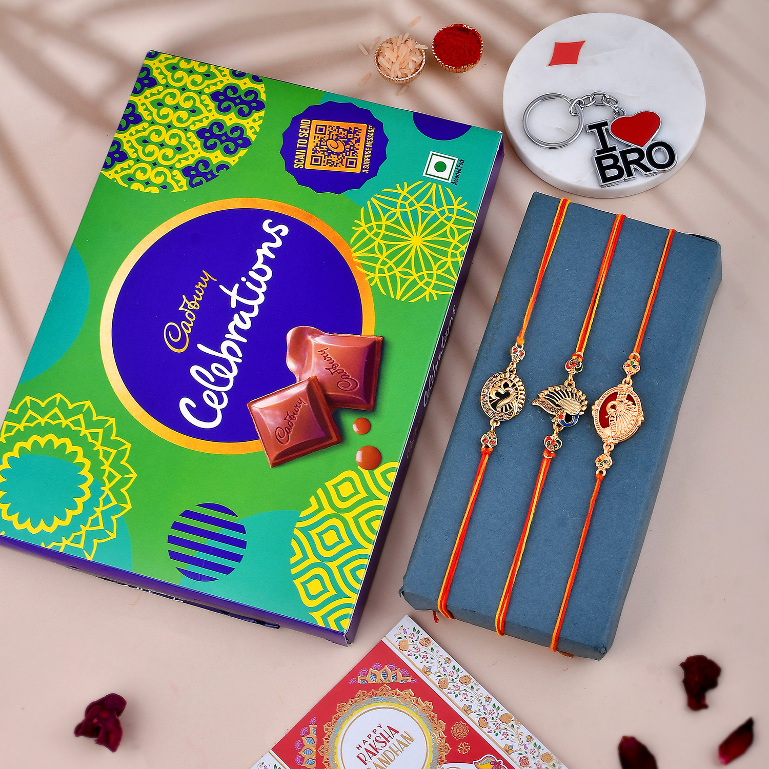 Image of Cadbury 1 Celebration Gift Box With 3 Rakhi 1 Roli Chawal 1 Greeting Card 1 Keychain Assorted Gift Box