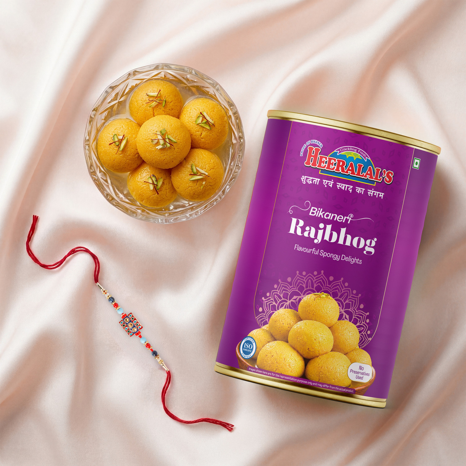 Image of Heeralal's Gift Pack 1 Rakhi + 1kg Bikaneri Raj Bhog Traditional Indian Mithai Premium Gift Silk Gift Box