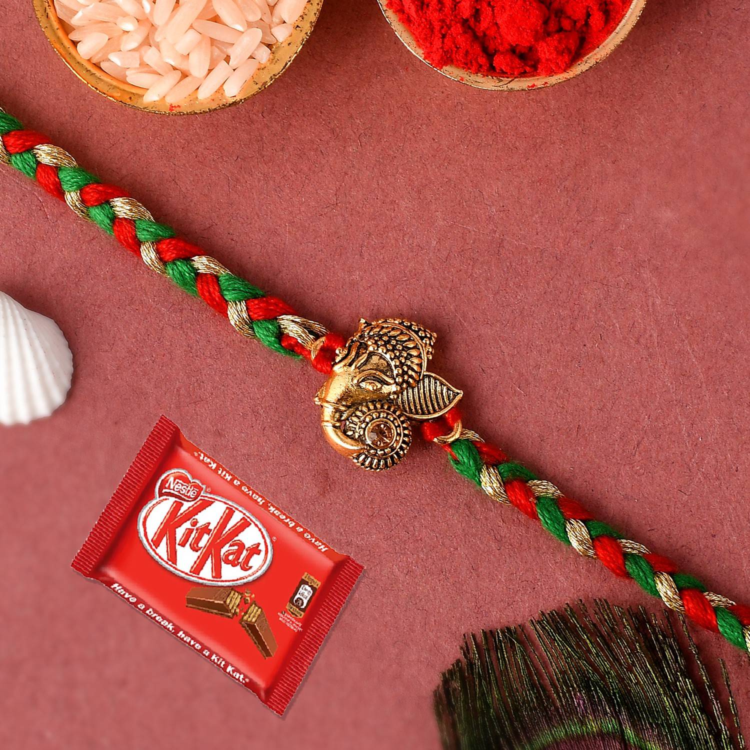 Ascension Ganesh ji Kundan Designer Rakhi for Brother & Nestle Kitkat Chocolate Assorted Gift Box