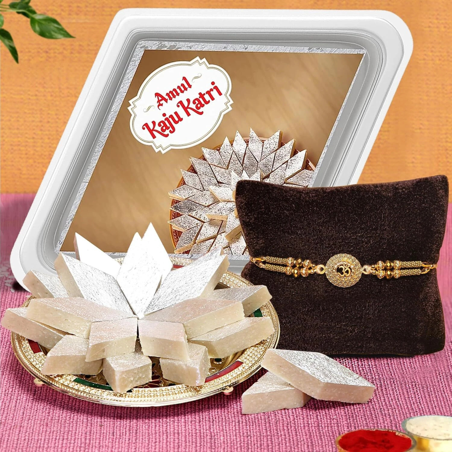 Image of TIED RIBBONS Rakhi for Brother with Sweets - 1 Ganesh Rakhi with Amul Kaju Katli Gift Hamper Assorted Gift Box