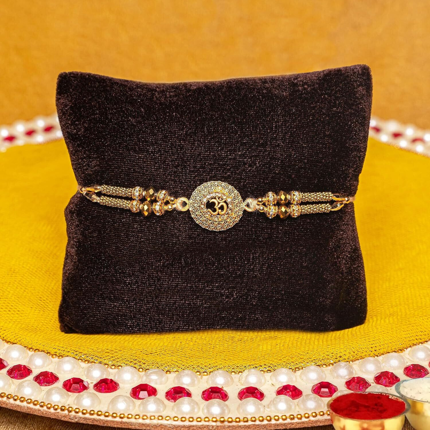 Image of TIED RIBBONS Rakhi for Brother with Sweets - 1 Ganesh Rakhi with Amul Kaju Katli Gift Hamper Assorted Gift Box