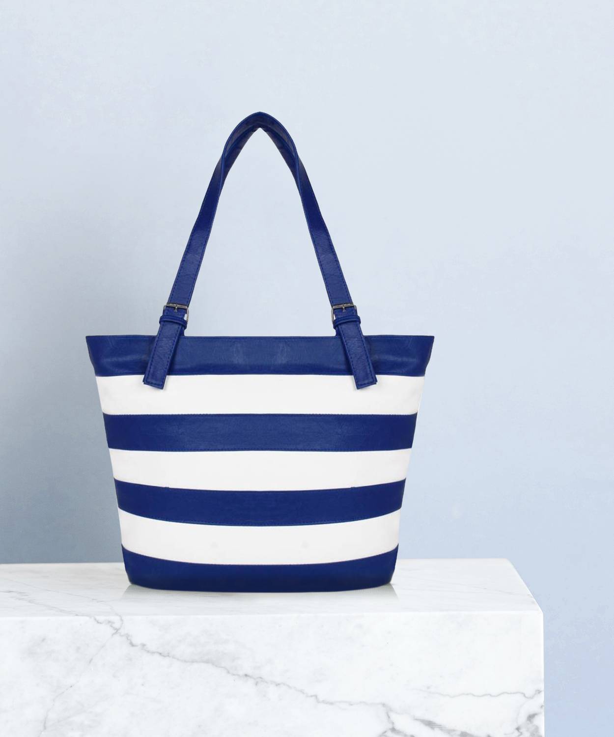avni's Women White, Blue Hand-held Bag