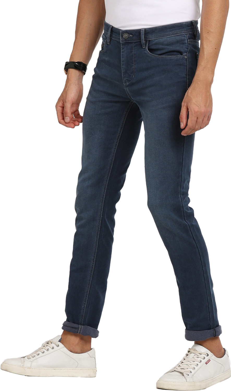 Image of TURTLE Men Tapered Fit Mid Rise Dark Blue Jeans