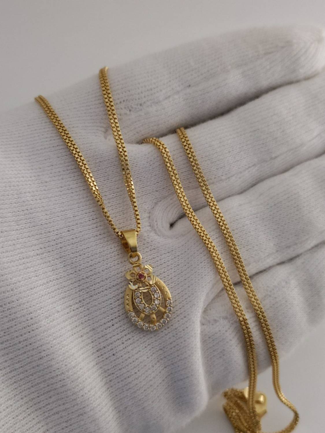 Bhagavati creation Bhagavati Gold-plated Brass Pendant Set