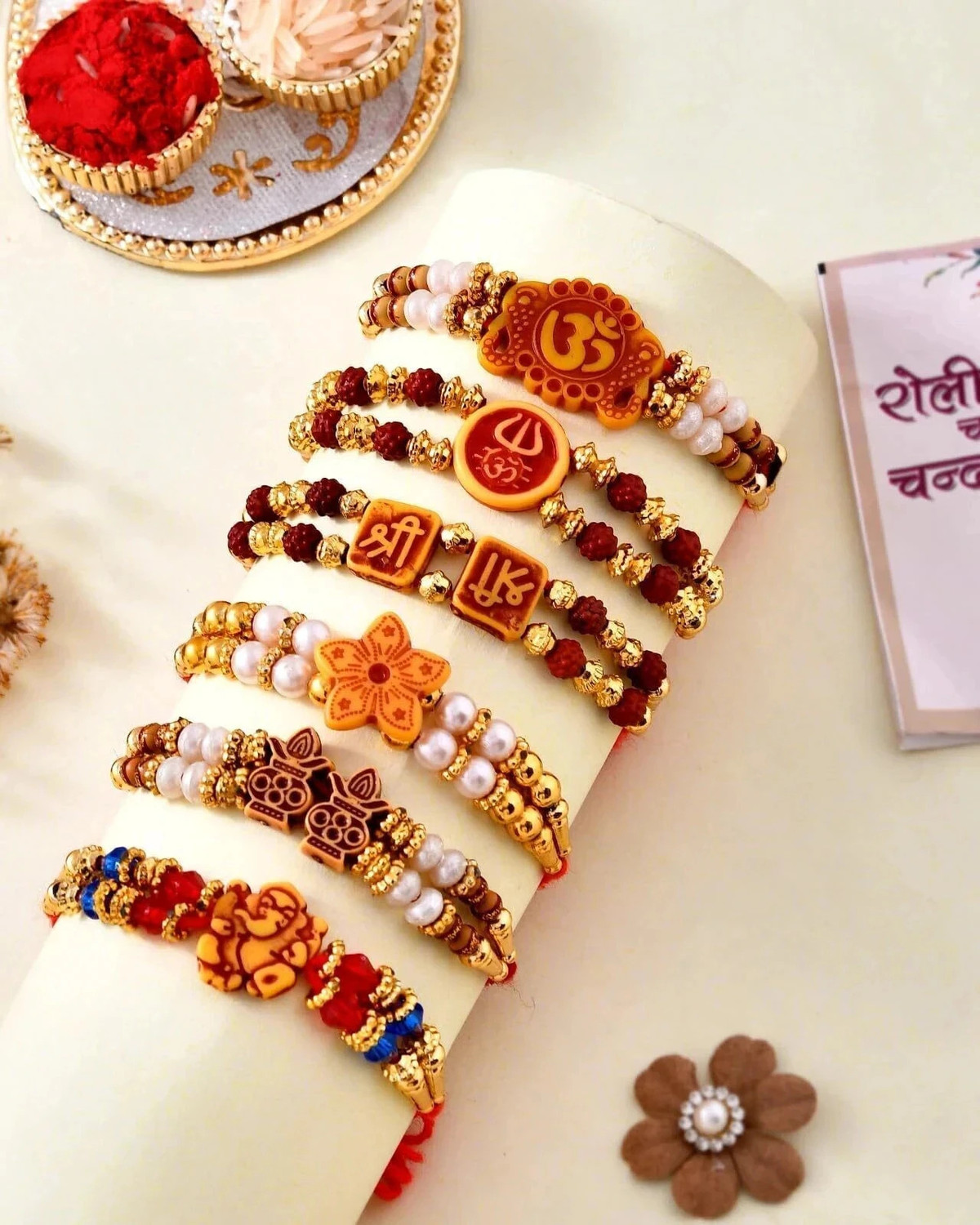 Flipkart SmartBuy Designer Rakhi Combo of 6 Dora Rakhi Set for Brother Bhai Bhabhi Kids with Roli Chawal and Best Wishes Greeting Card, rakhi set of 6 Mauli Thread Rakhi, Chawal Roli Pack, Greeting Card Set (Set of 6 Multi Design Rudraksh Rakhi for Bhaiya Bhabhi Kids, 2 Traditional Om Swastik Rudrakash rakhi, Colorful Greeting Card with Roli Chawal)