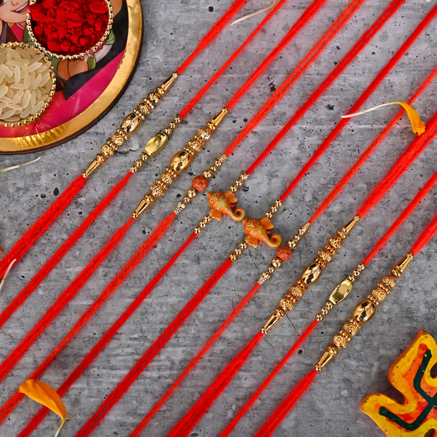 Image of Religious Pack of 10 Mauli Thread Rakhi by Poorak