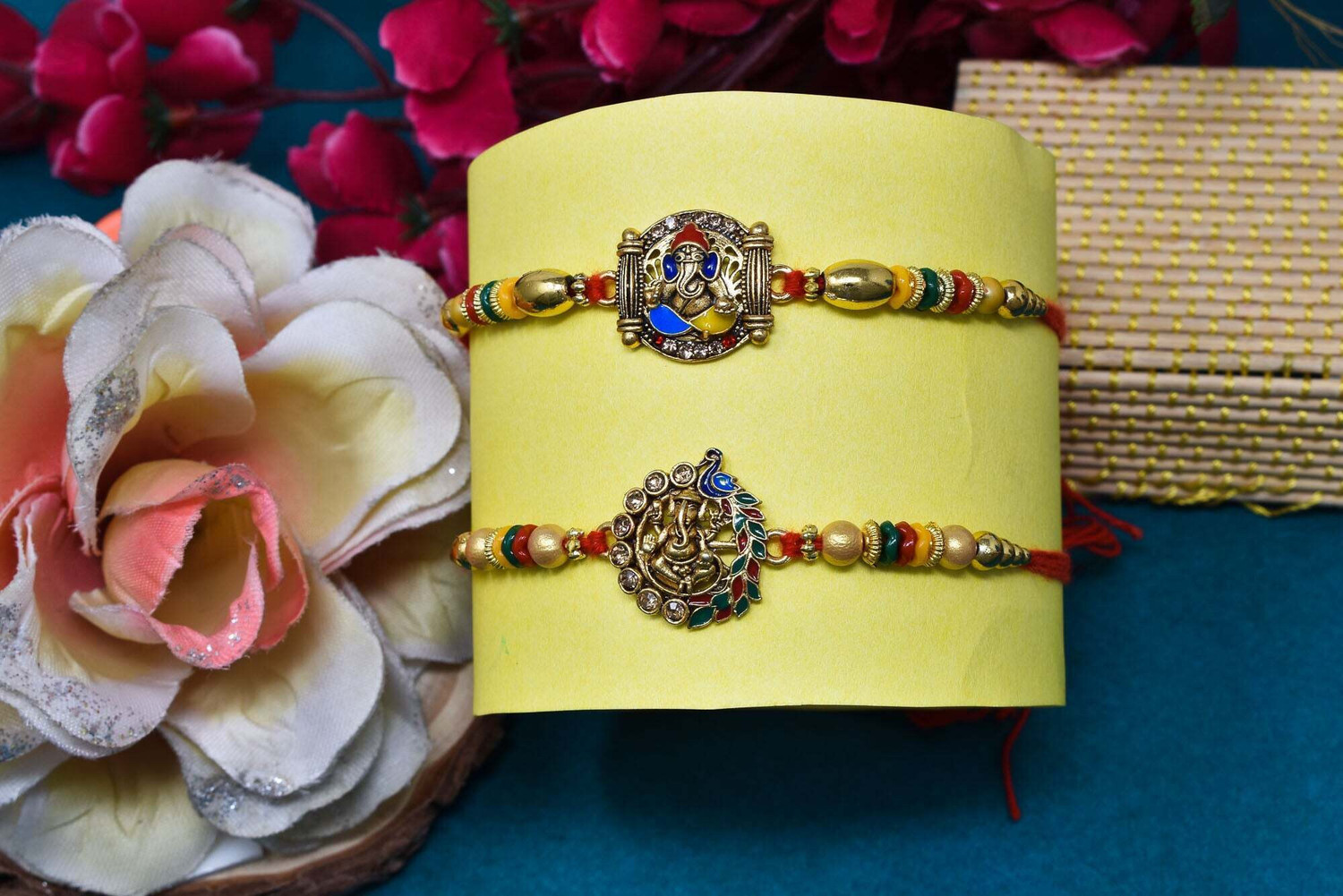 Image of Bhaiya Bhabhi Brass Elegant Ganesha Combo Rakhi for Brother Kids 147 Mauli Thread, Gold Finish, Pearl, Silver Rakhi, Greeting Card, Chawal Roli Pack Set by Meira Jewellery