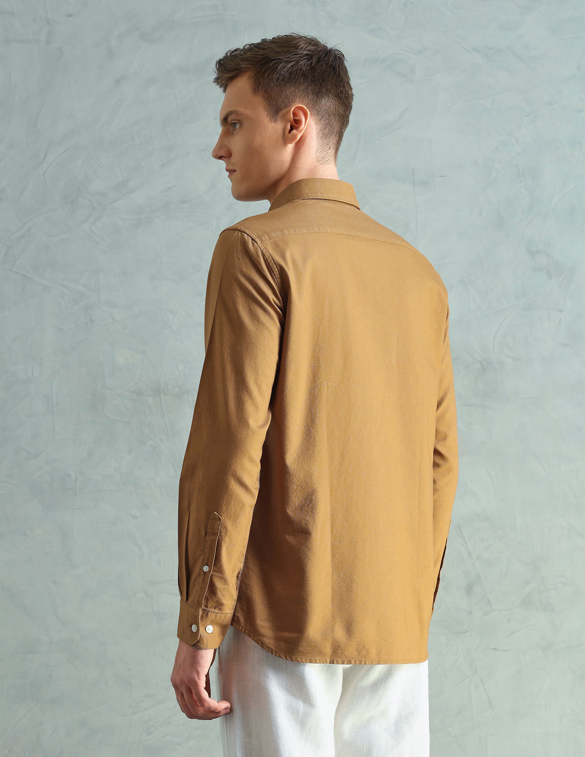 Image of Arrow Sport Men Solid Casual Orange Shirt