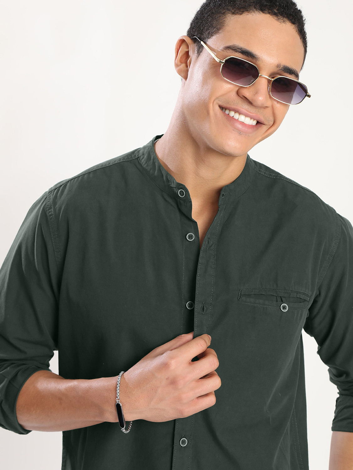 Image of Roadster Men Solid Casual Dark Green Shirt
