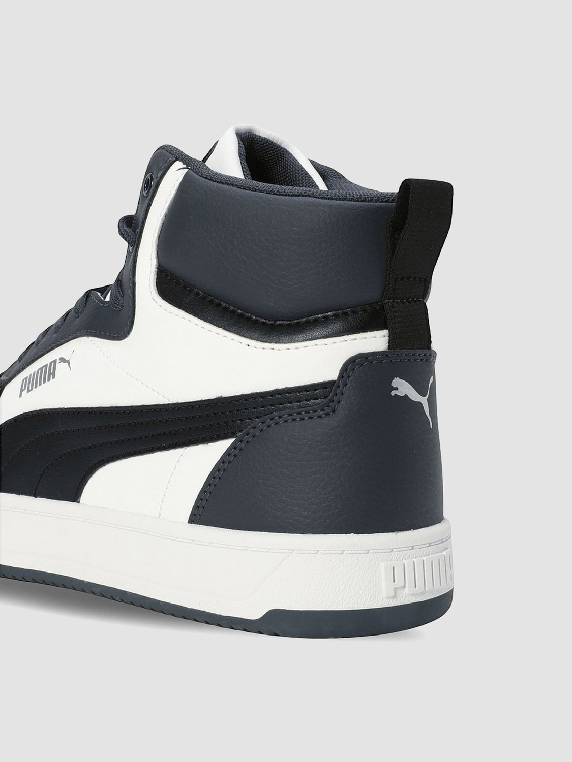 Image of PUMA Caven 2.0 Mid Sneakers For Men