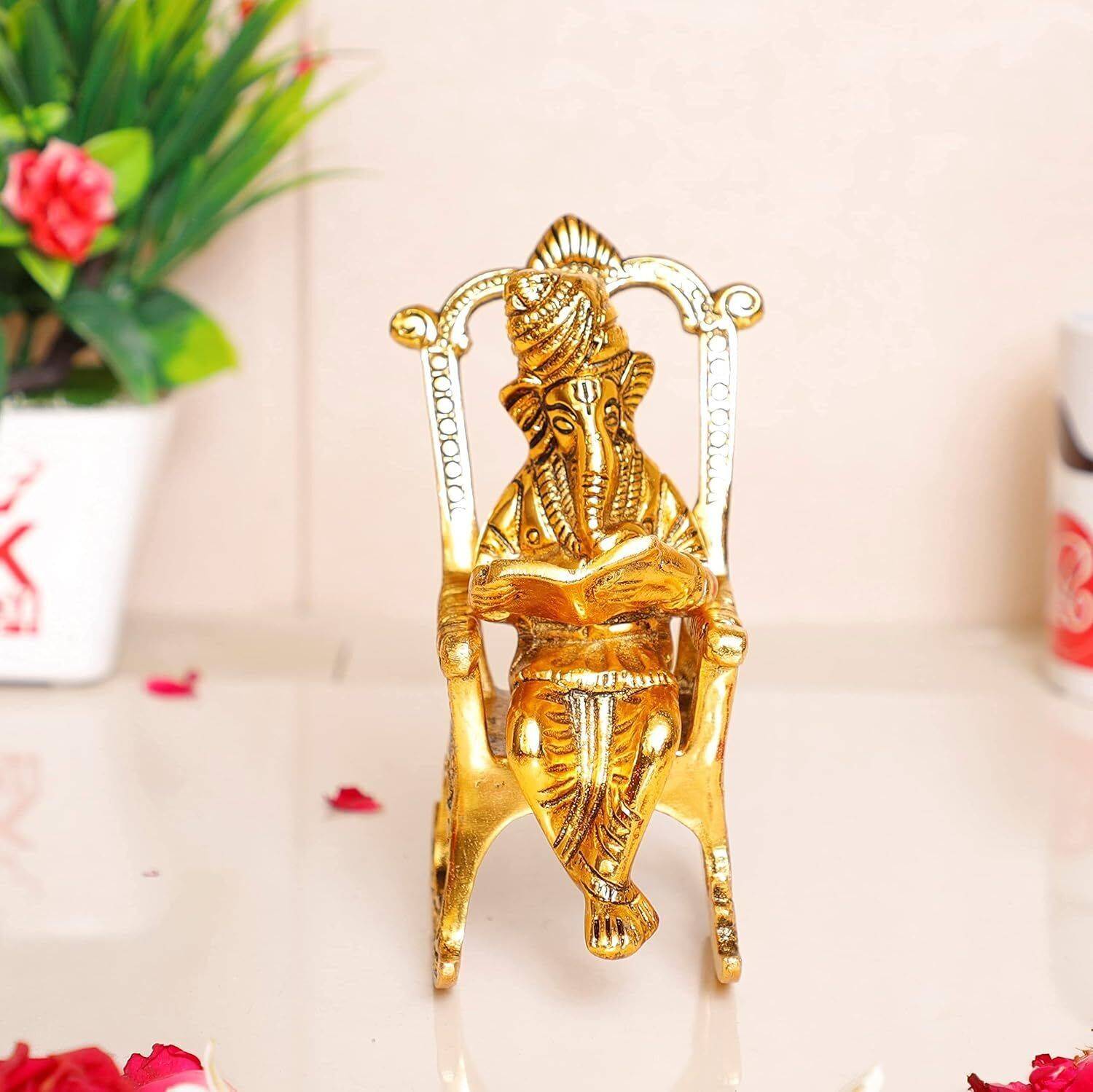 Pucchi Lord Ganesha Idol on Chair Reading Book Idol, Ganesha Idol for Home temple Decorative Showpiece - 22.700000000000024 cm