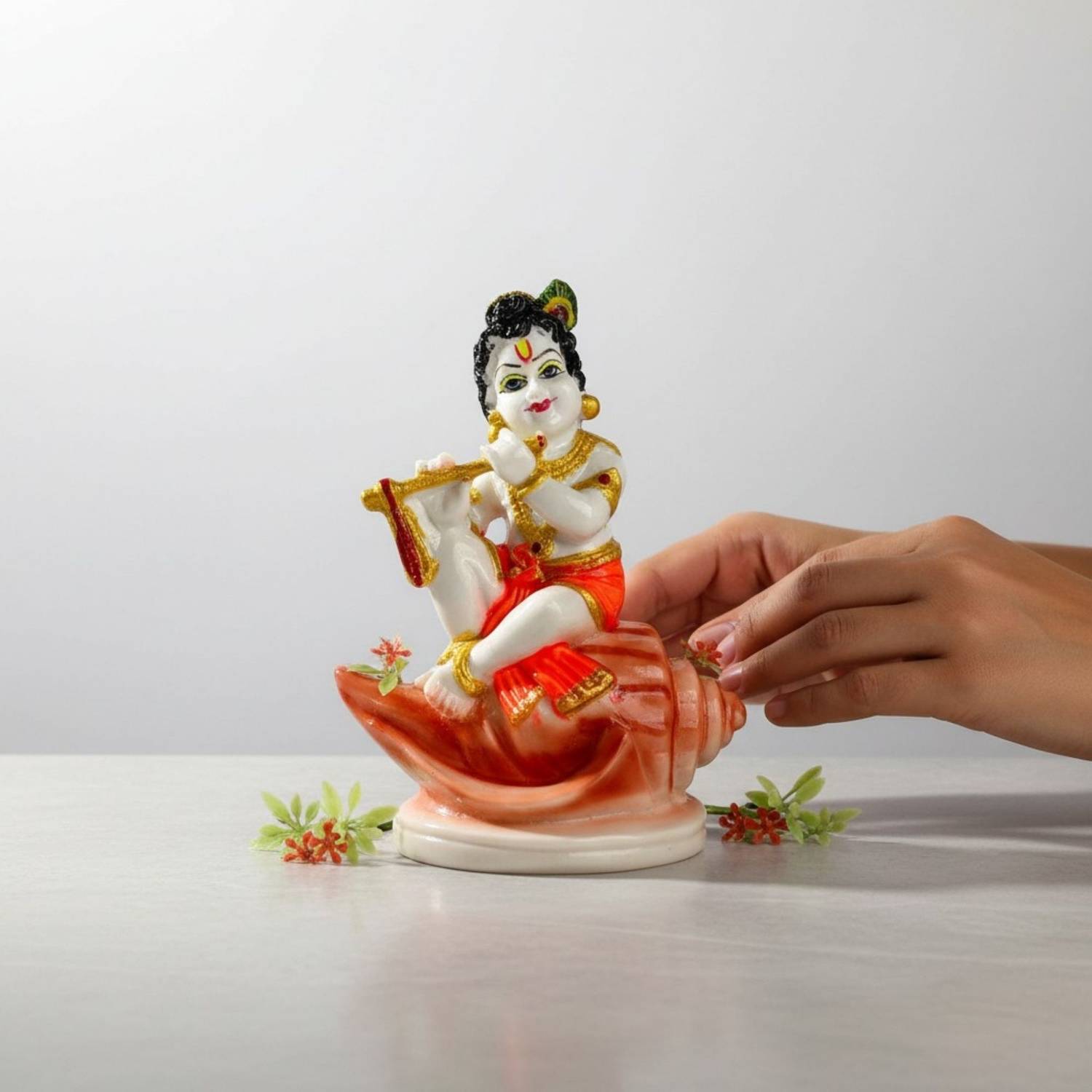 AVG ARTISTRY Bal Krishna Sitting on Shank Idol Resin Finish Laddu Gopal Murti for Home Puja Decorative Showpiece  -  11.5 cm