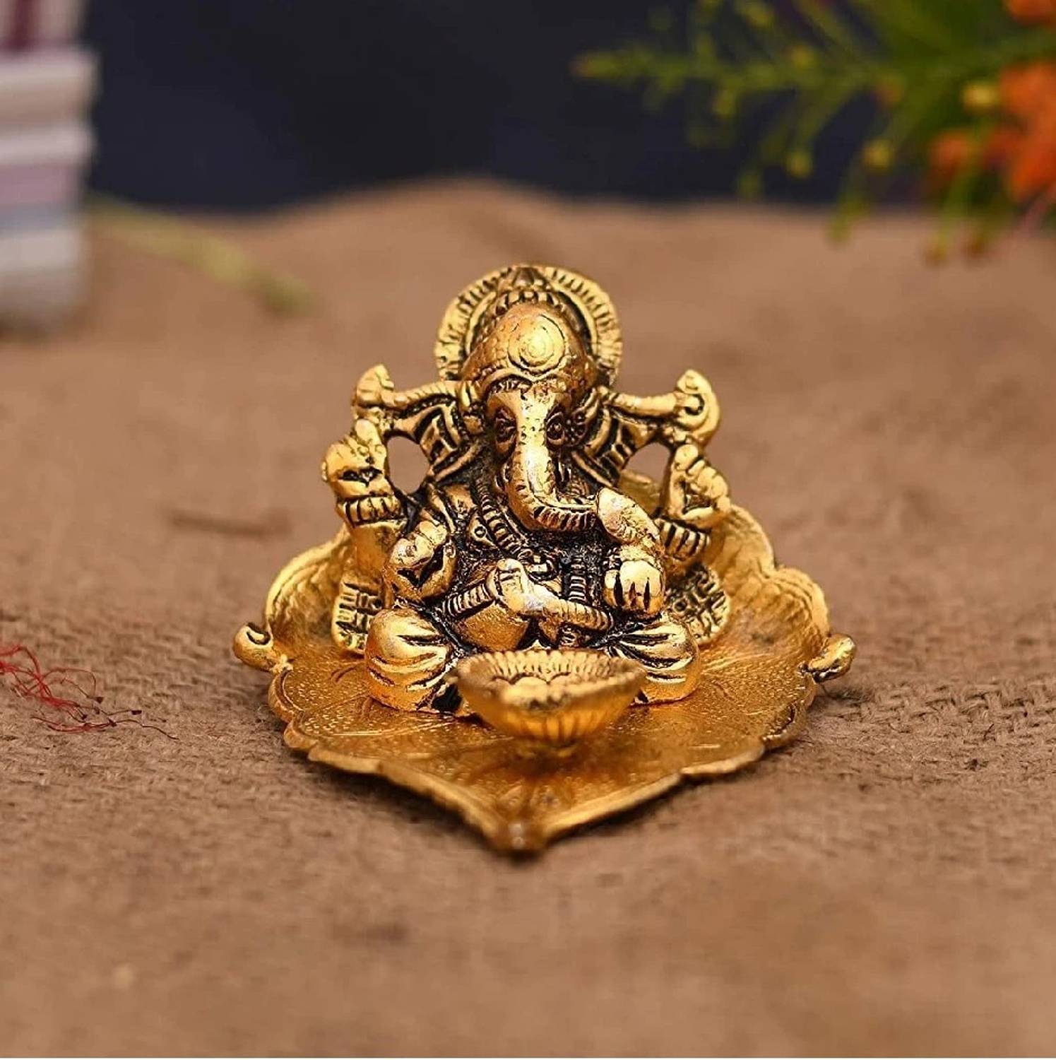 anil job works Metal Lord Ganesh Idol on Leaf with Diya for Home Decor and Gifts Decorative Showpiece - 7.62 cm