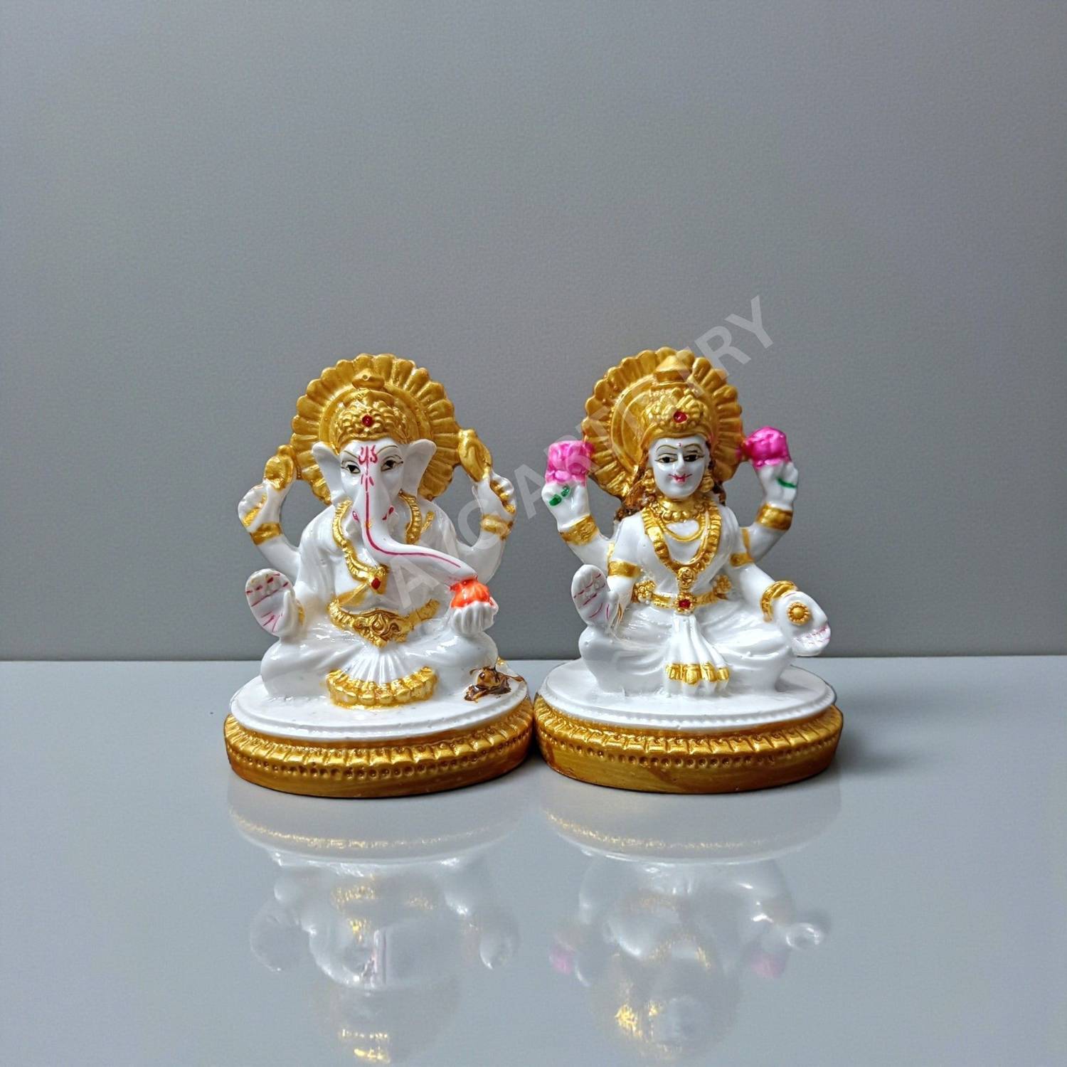 AVG ARTISTRY Laxmi Ganesh Idol Pair Resin Statue for Diwali Puja Home Temple Decorative Showpiece  -  7.5 cm