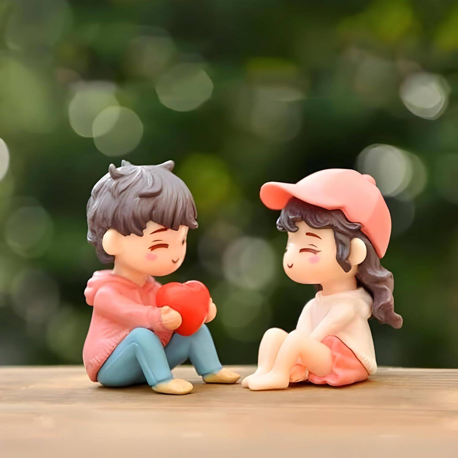 Brahmani world 2 Set Couple Miniature in Purple Outfits | Boy & Girl Sitting Showpiece for Home Decorative Showpiece  -  4 cm