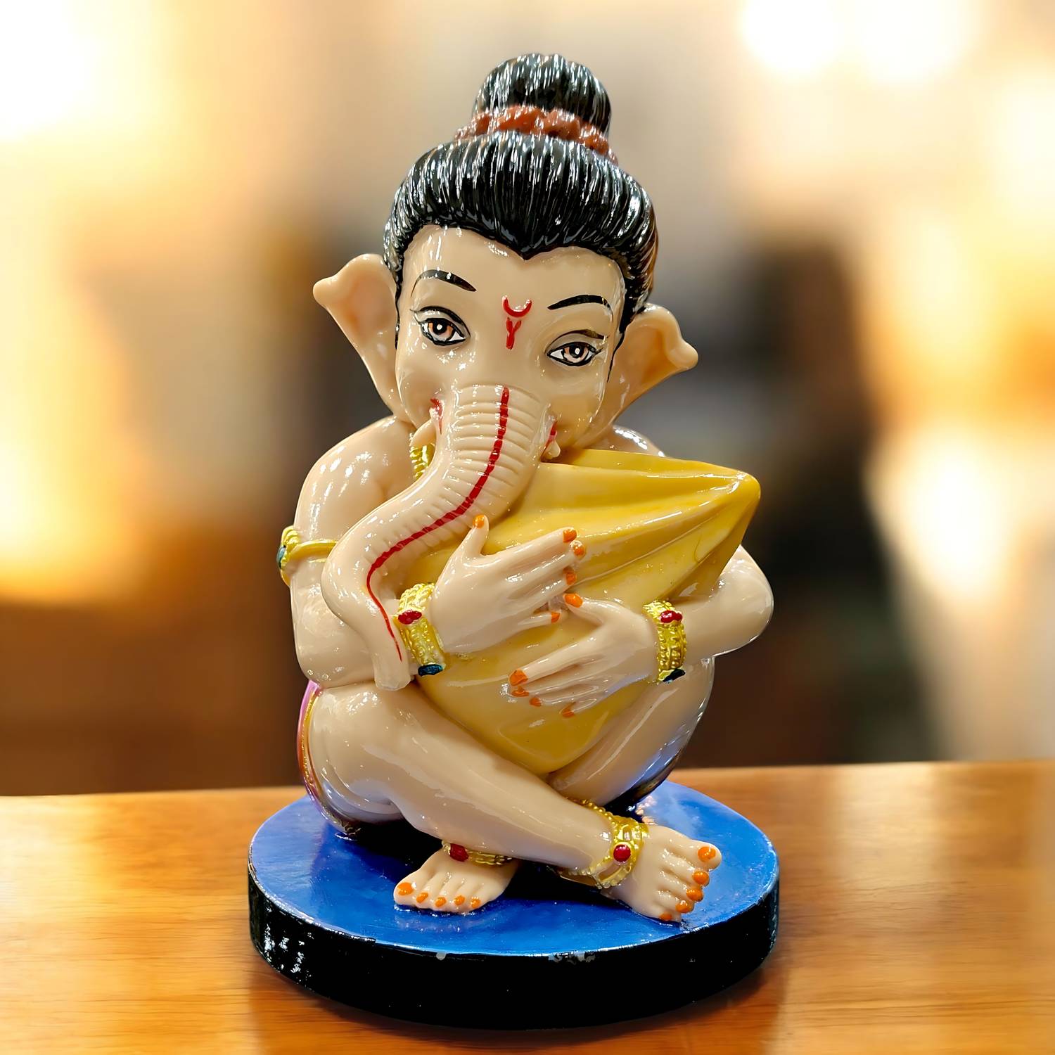 DecorNx Bal Ganesha Idol with Modak Decorative Showpiece  -  15 cm