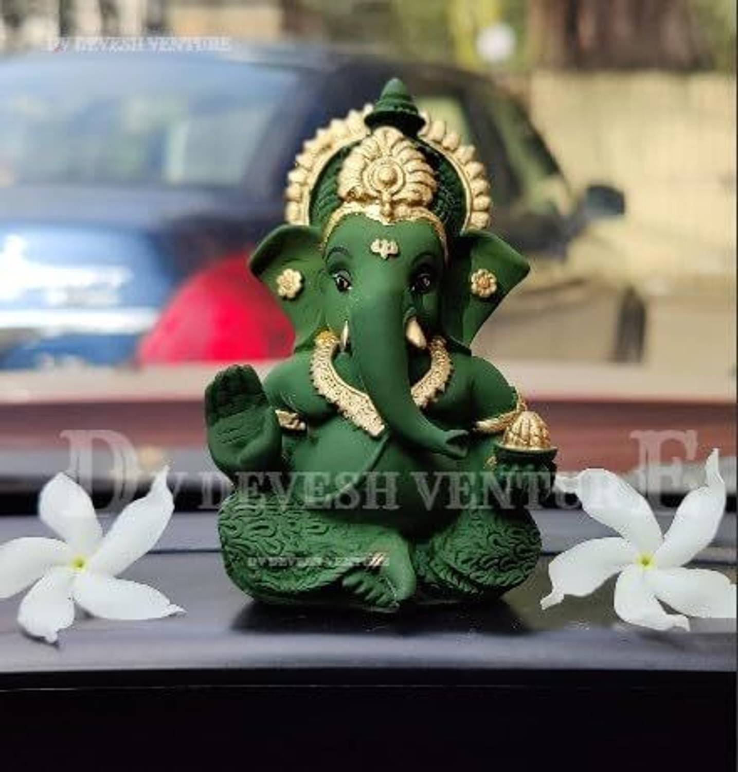 DV Devesh Venture Shri Ganesh murti in green colour golden mukut Ganpati Idol For Car Dashboard Decorative Showpiece - 9 cm