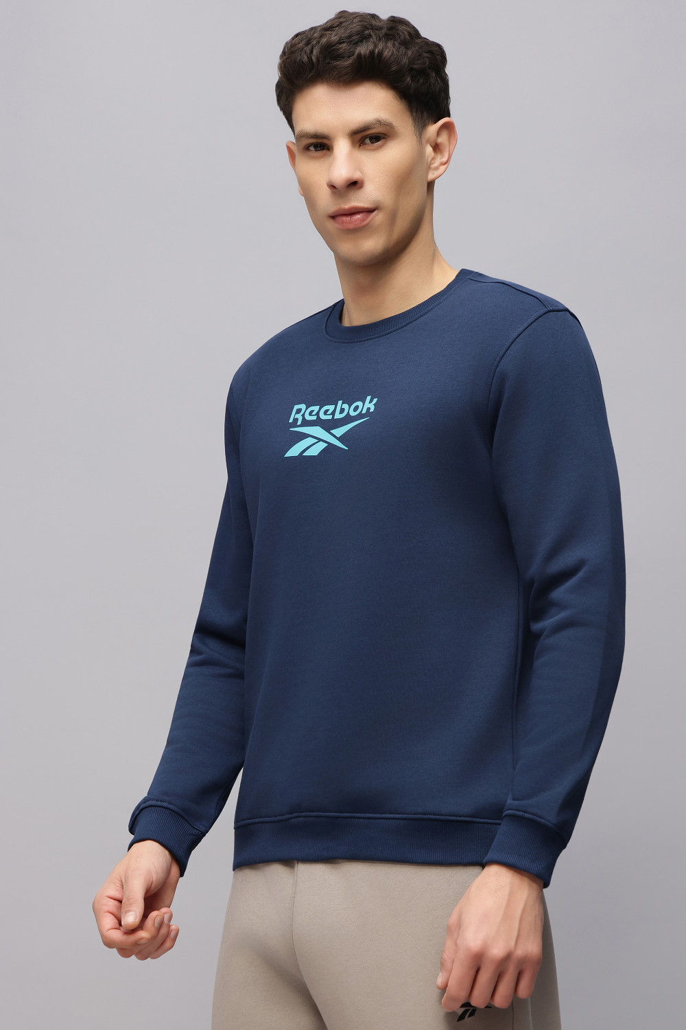 Image of REEBOK Full Sleeve Solid Men Sweatshirt