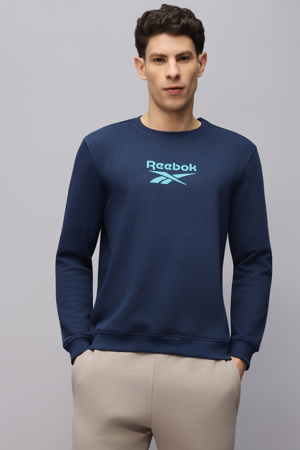 Image of REEBOK Full Sleeve Solid Men Sweatshirt