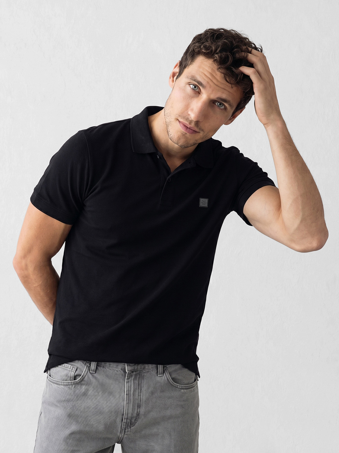 Image of WROGN Solid Men Polo Neck Black T-Shirt