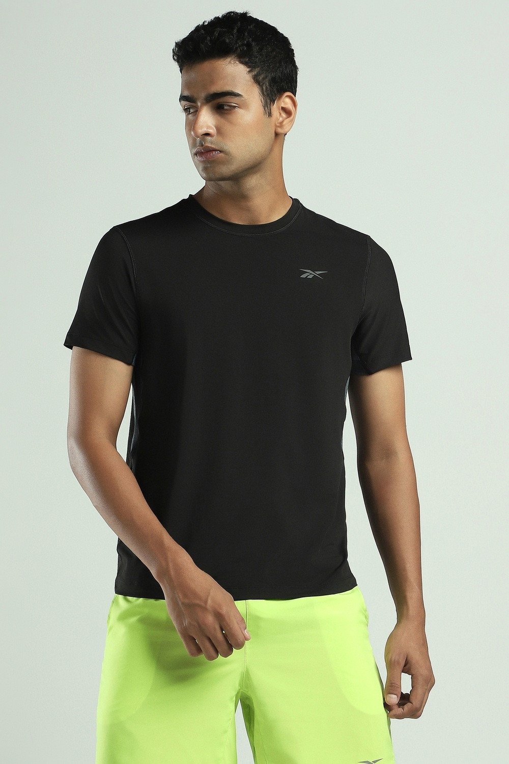 Image of REEBOK Solid Men Round Neck Black T-Shirt