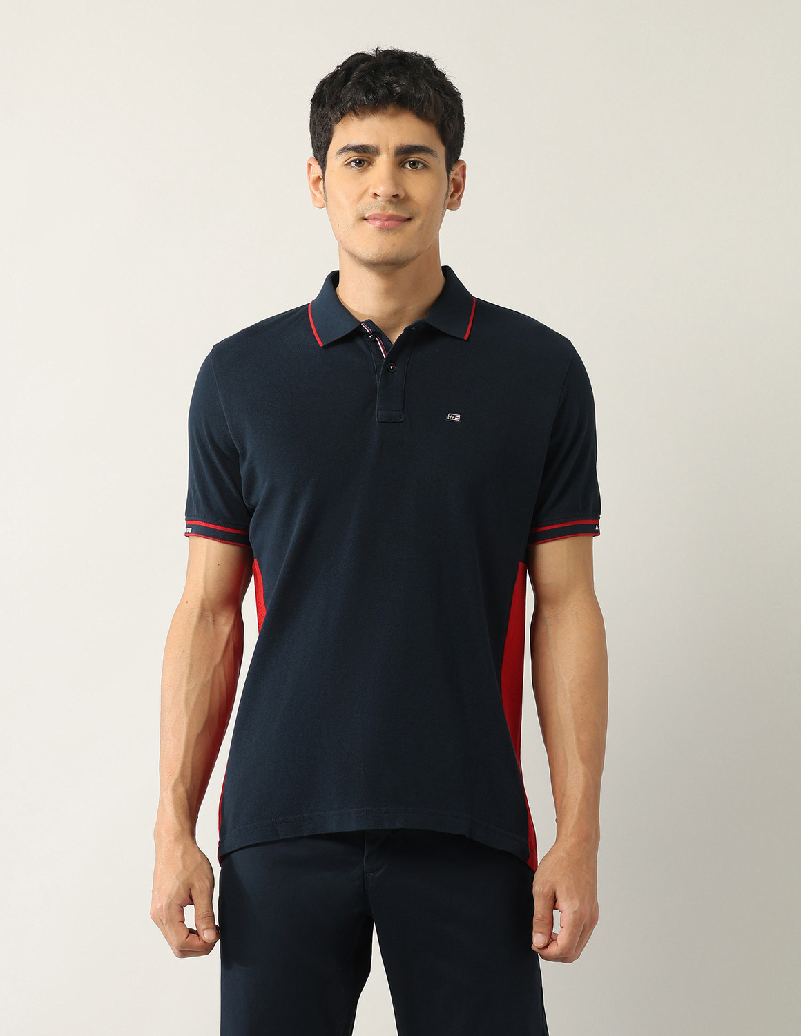 Image of Arrow Sport Solid, Colorblock Men Polo Neck Blue T-Shirt