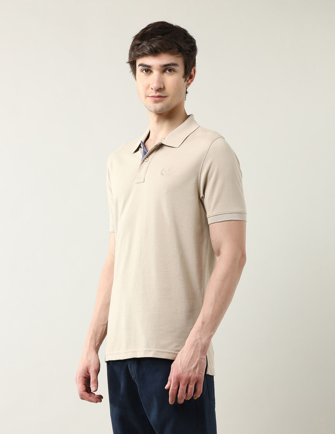 Image of Arrow Sport Solid Men Polo Neck Beige T-Shirt