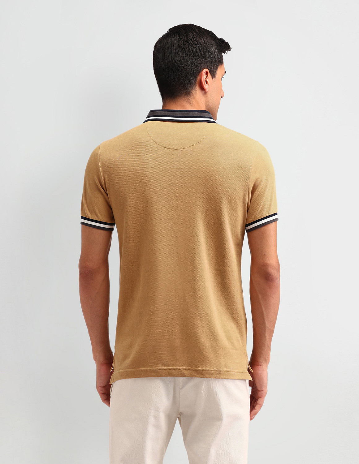 Image of U.S. POLO ASSN. Solid Men Polo Neck Brown T-Shirt