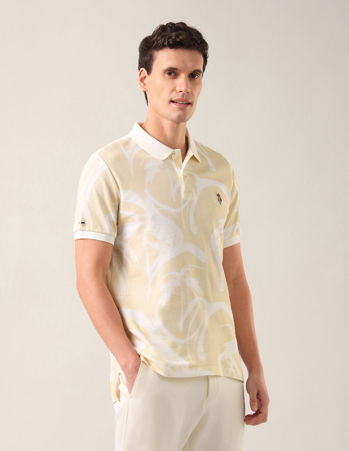 Image of U.S. Polo Assn. Denim Co. Men Printed Polo Neck Pure Cotton Beige T-Shirt