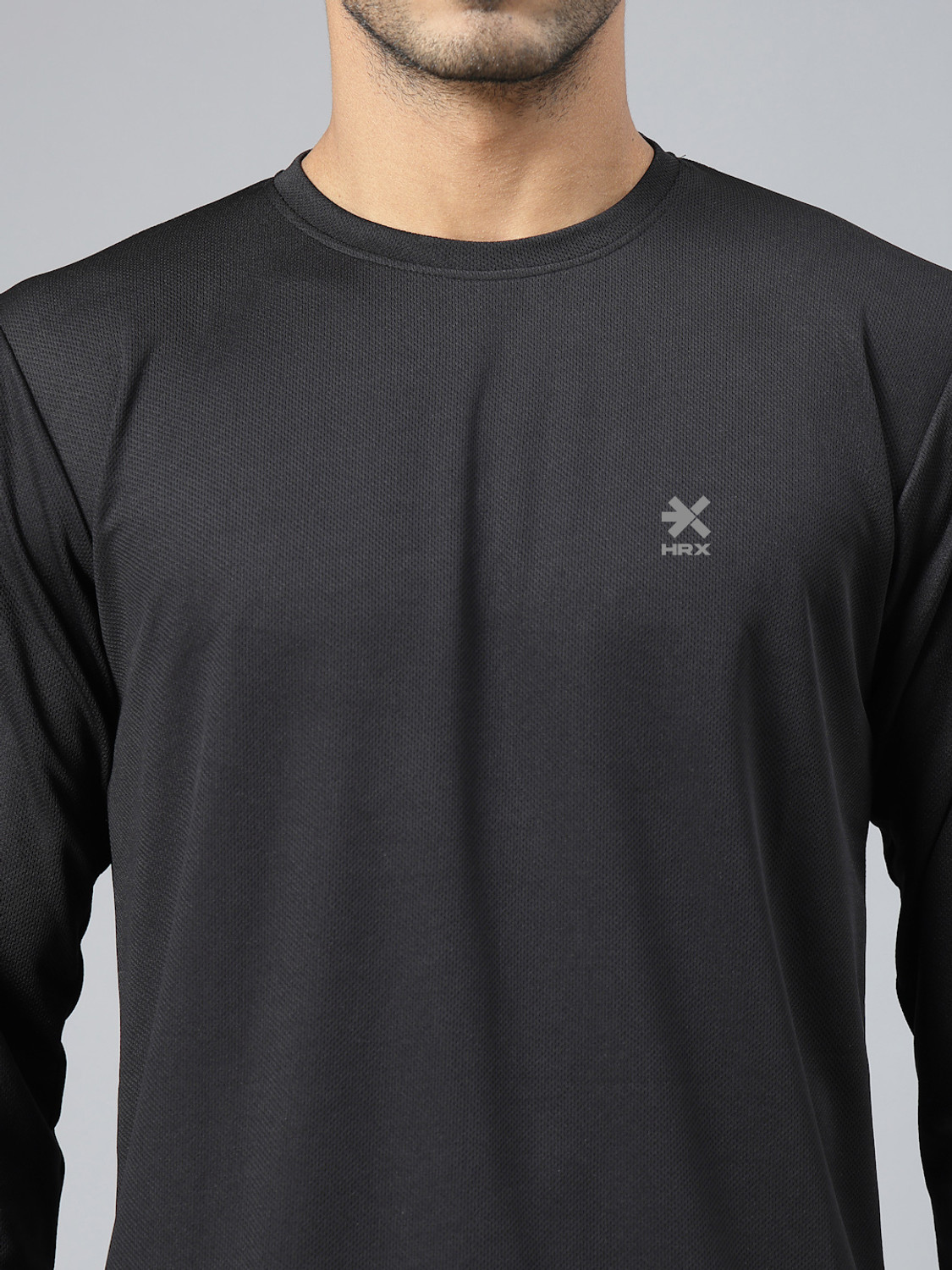 Image of HRX by Hrithik Roshan Solid Men Round Neck Black T-Shirt