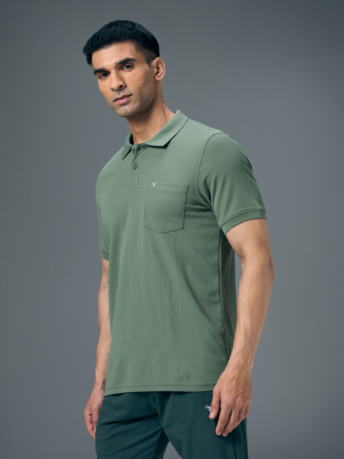 Image of TECHNOSPORT Solid Men Polo Neck Green T-Shirt