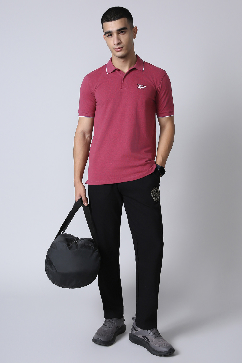 Image of REEBOK Men Solid Polo Neck Polyester Red T-Shirt