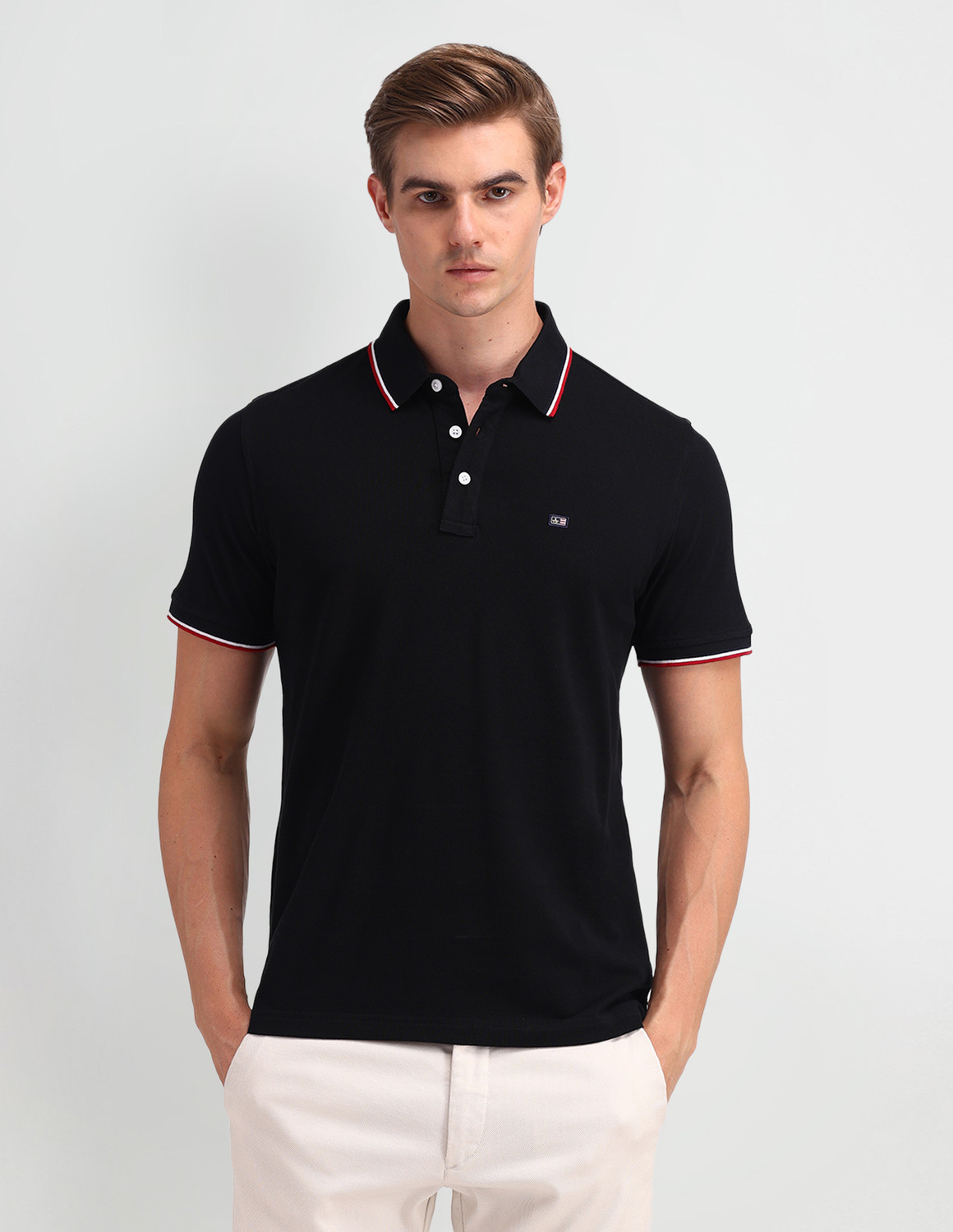 Image of Arrow Sport Solid Men Polo Neck Black T-Shirt