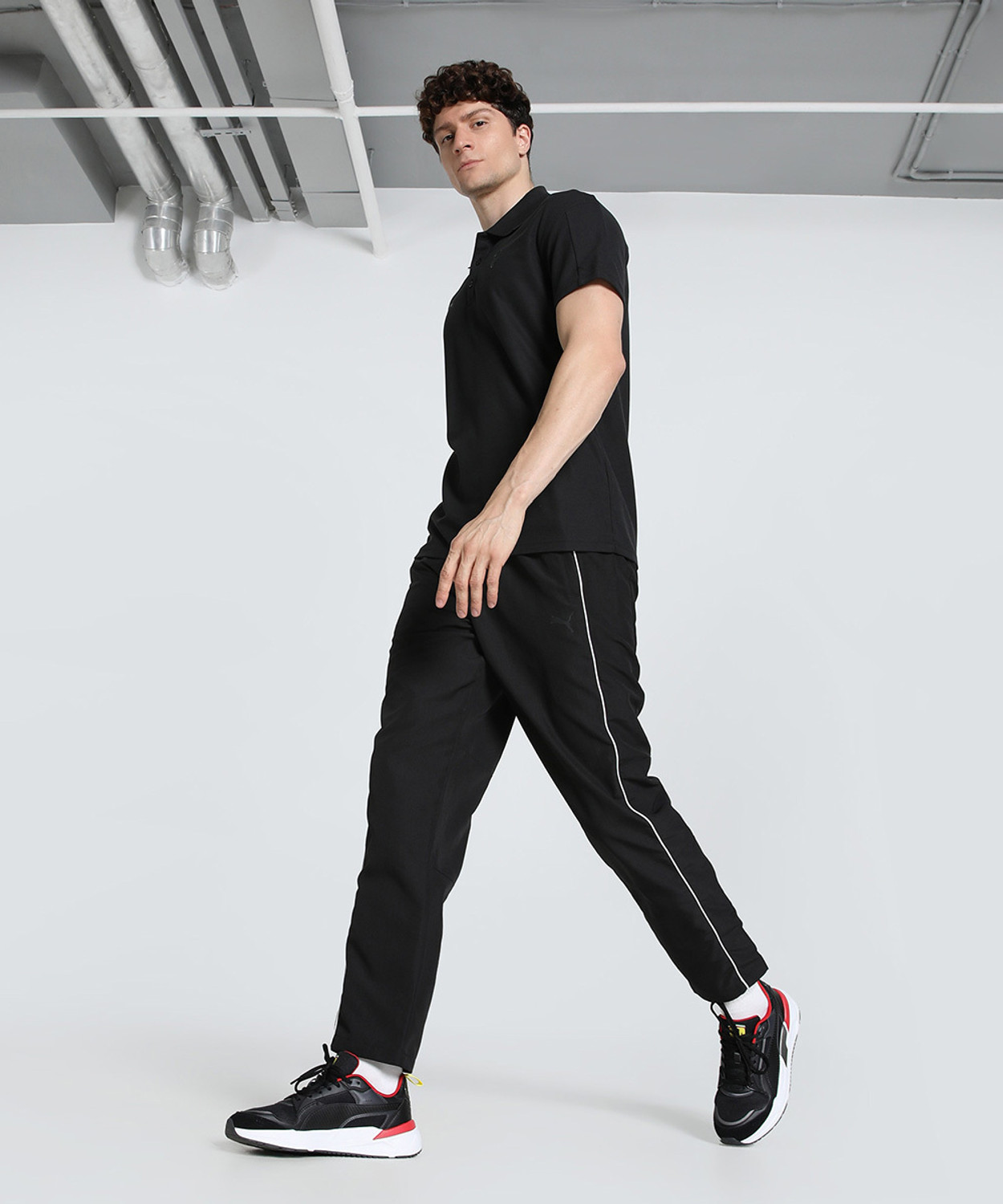 Image of PUMA Men Solid Polo Neck Pure Cotton Black T-Shirt
