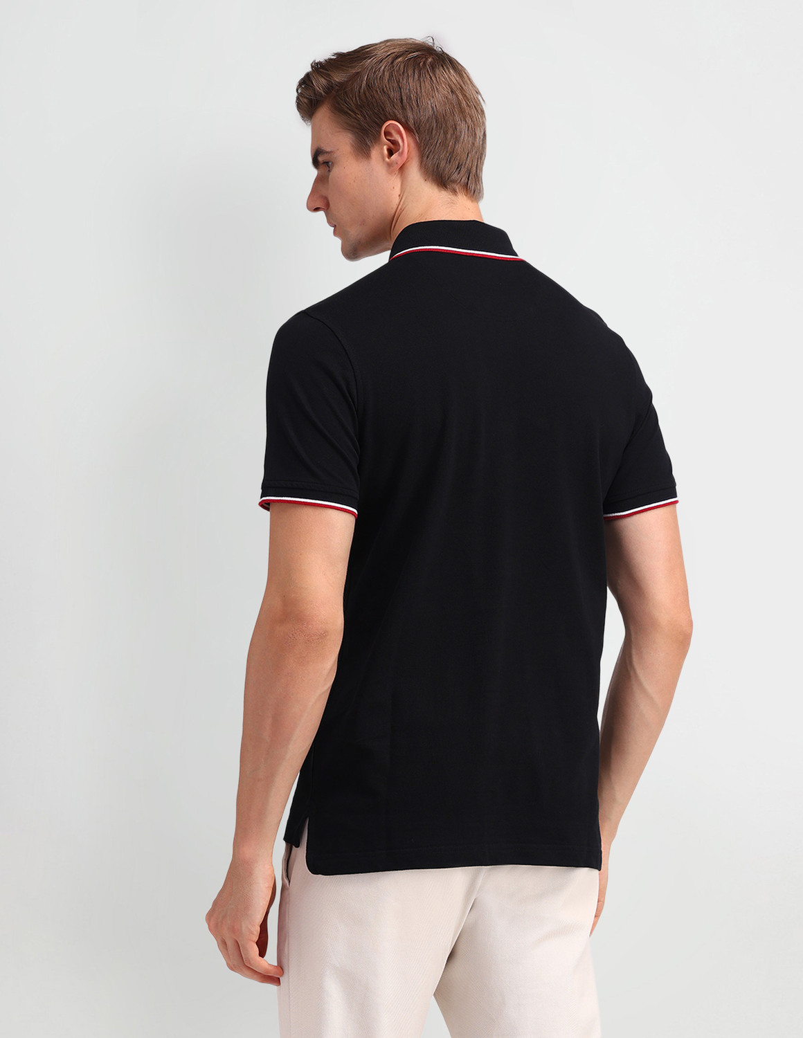 Image of Arrow Sport Solid Men Polo Neck Black T-Shirt