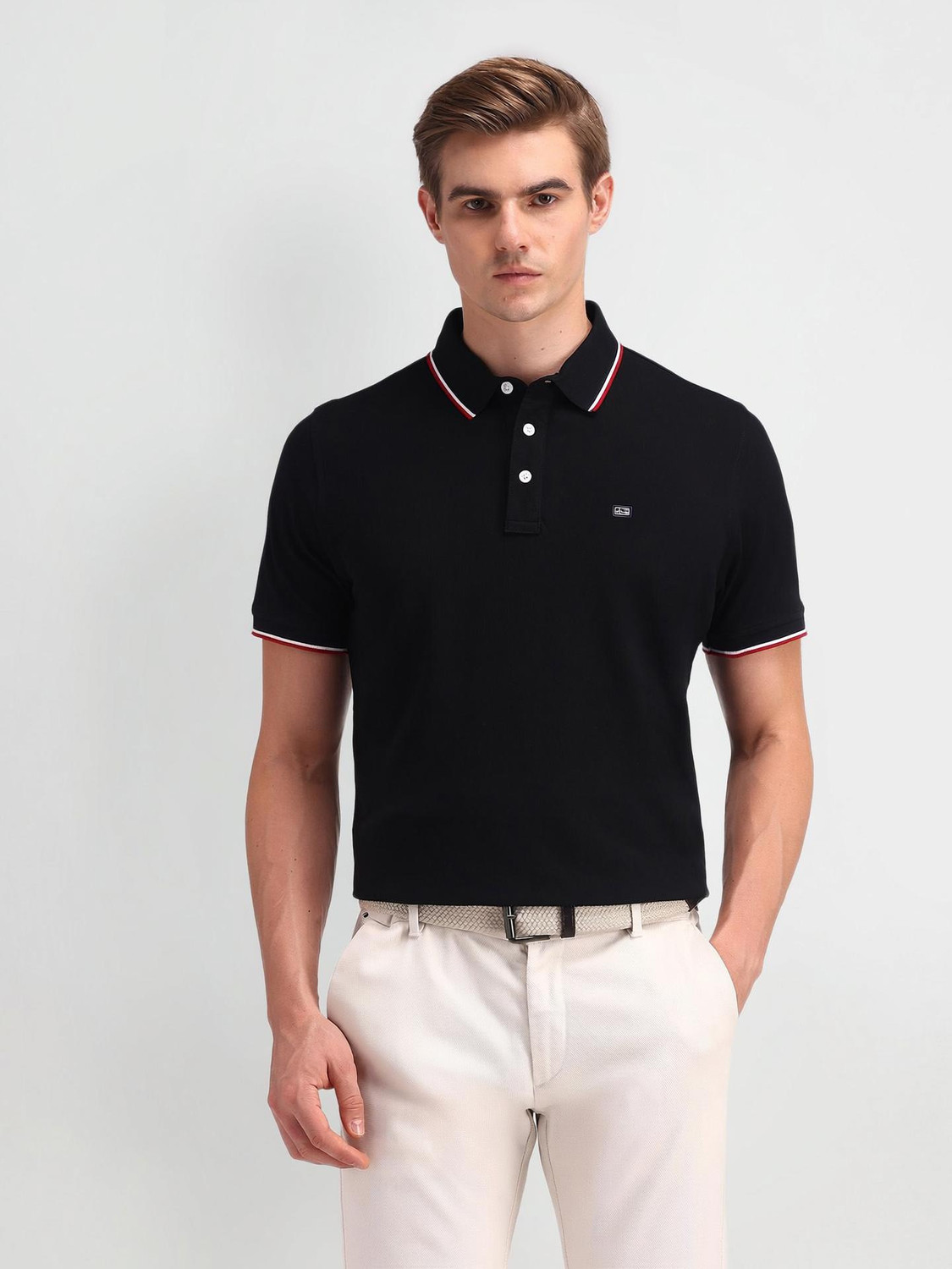 Image of Arrow Sport Solid Men Polo Neck Black T-Shirt