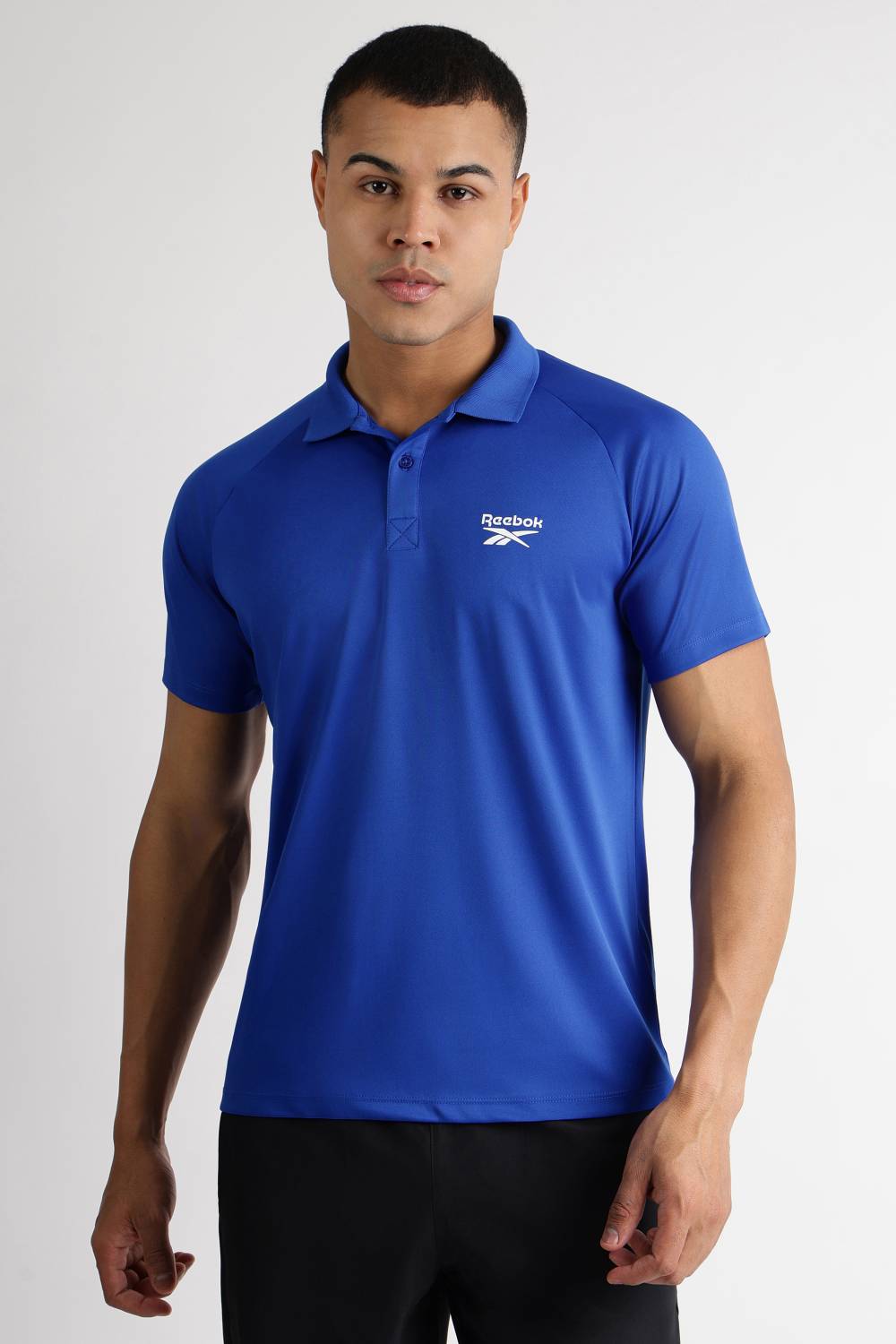 REEBOK Men Solid Polo Neck Polyester Blue T-Shirt