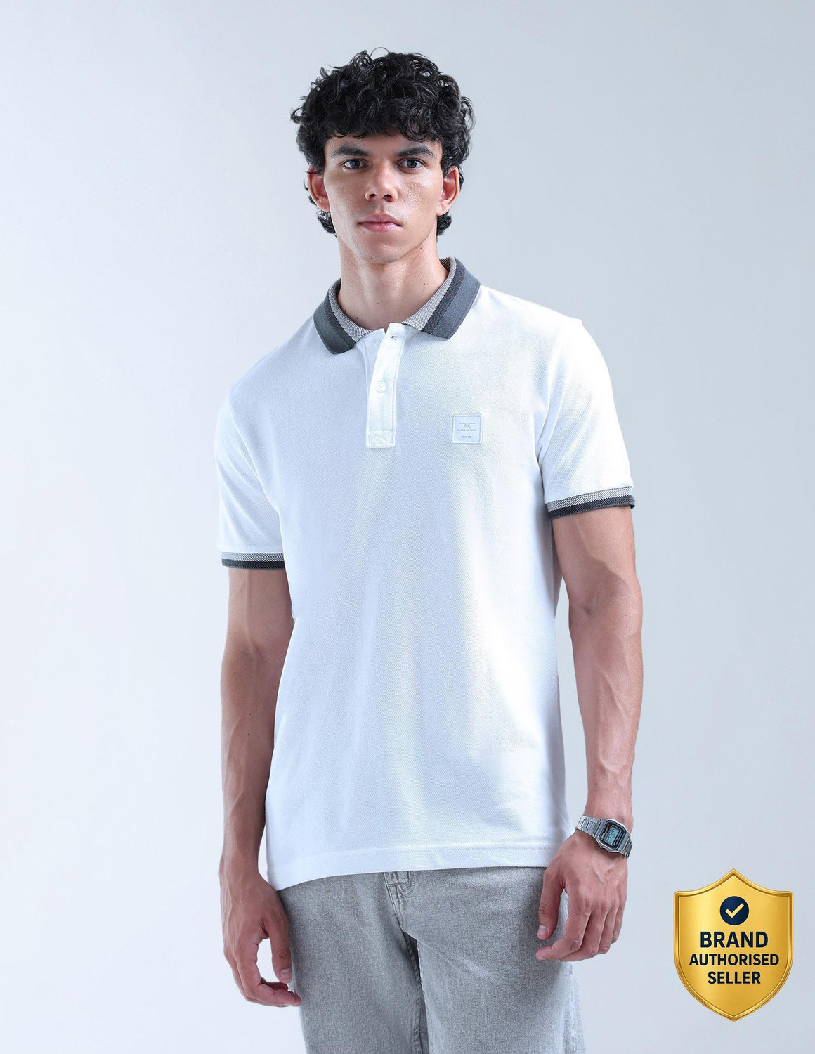 Image of FLYING MACHINE Solid Men Polo Neck White T-Shirt