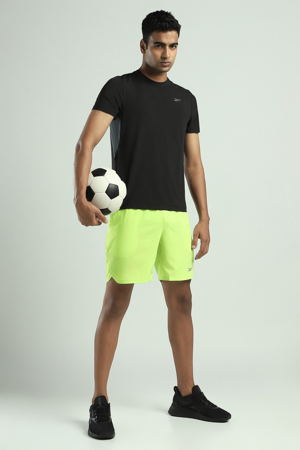 Image of REEBOK Solid Men Round Neck Black T-Shirt