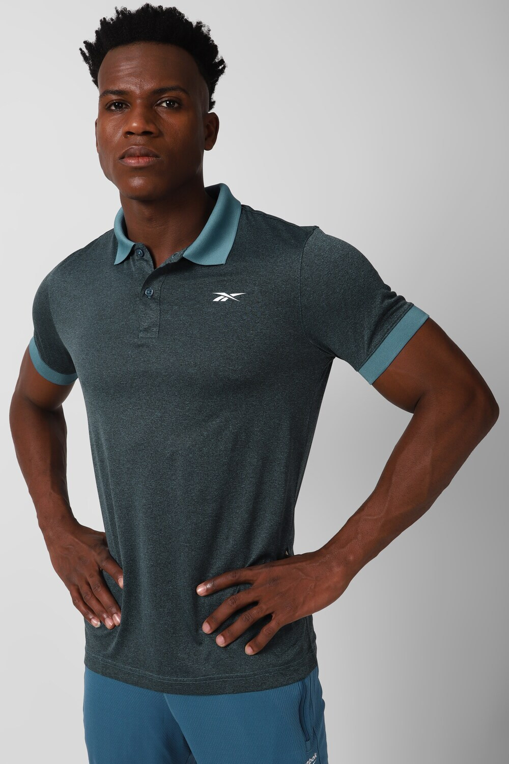 Image of REEBOK Printed Men Polo Neck Blue T-Shirt